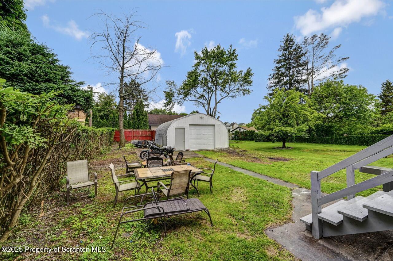 1223 Eynon Street Scranton, PA 18504 - Photo 41 of 42 a swimming pool with barbeque oven outdoor seating and yard