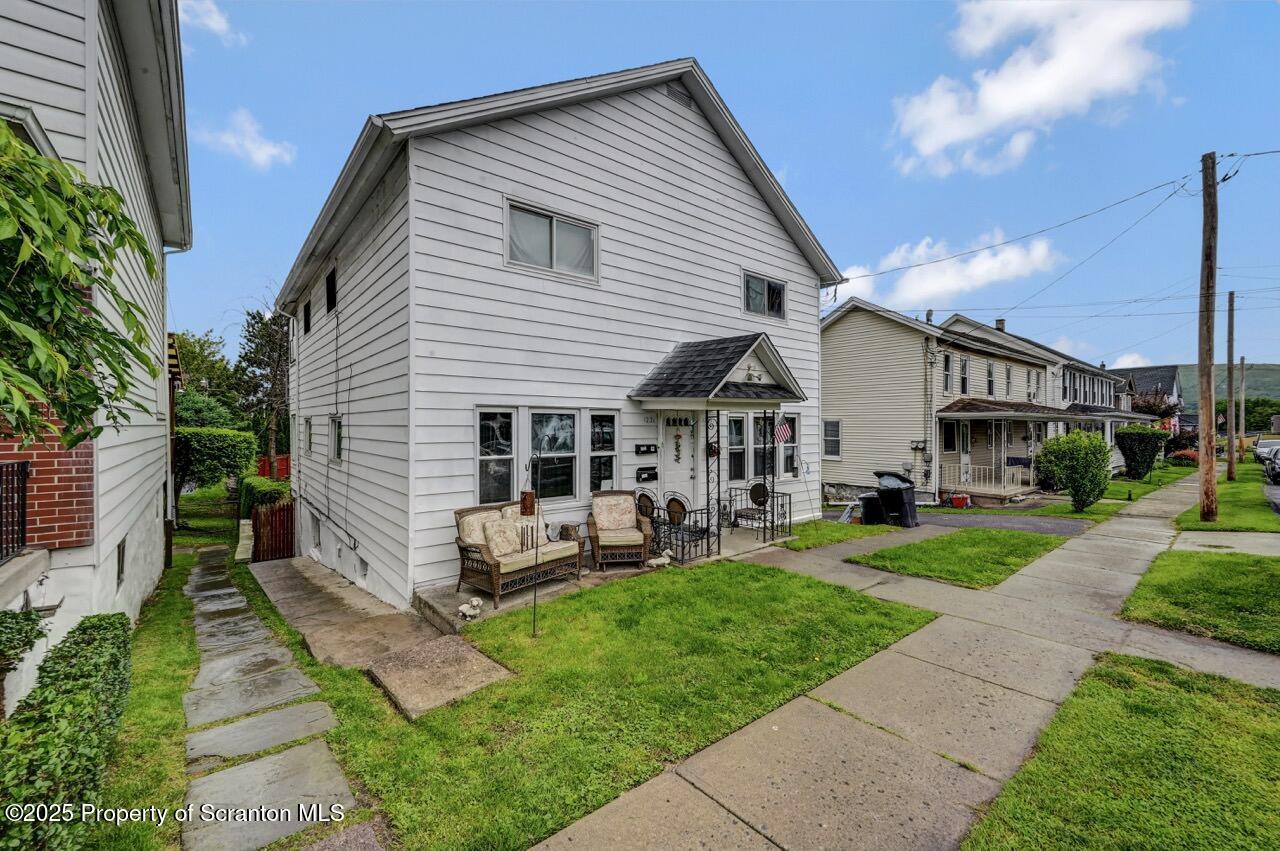 1223 Eynon Street Scranton, PA 18504 - Photo 42 of 42 a view of a house with sitting area and garden