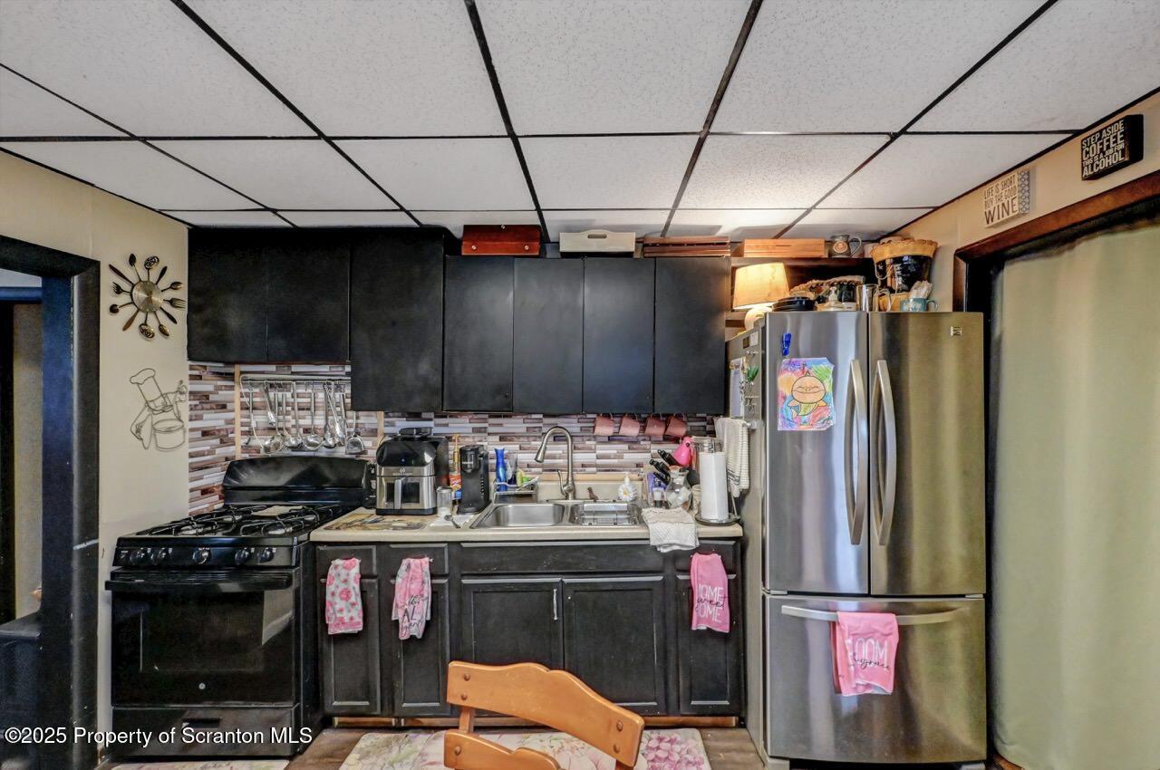 1223 Eynon Street Scranton, PA 18504 - Photo 9 of 42 a kitchen with refrigerator and stove