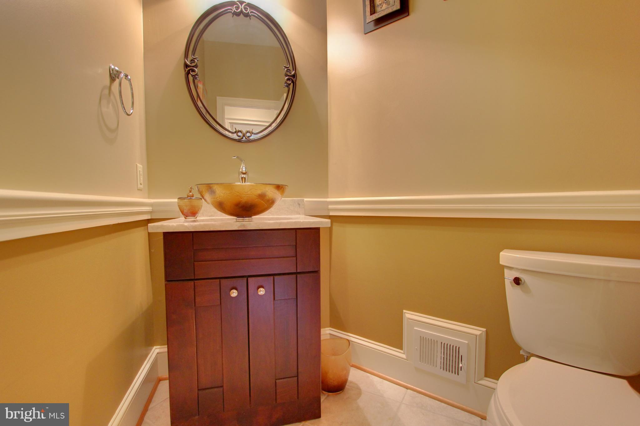 13705 Loria Court Clarksville, MD 21029 - Photo 19 of 30 a bathroom with a toilet and a mirror