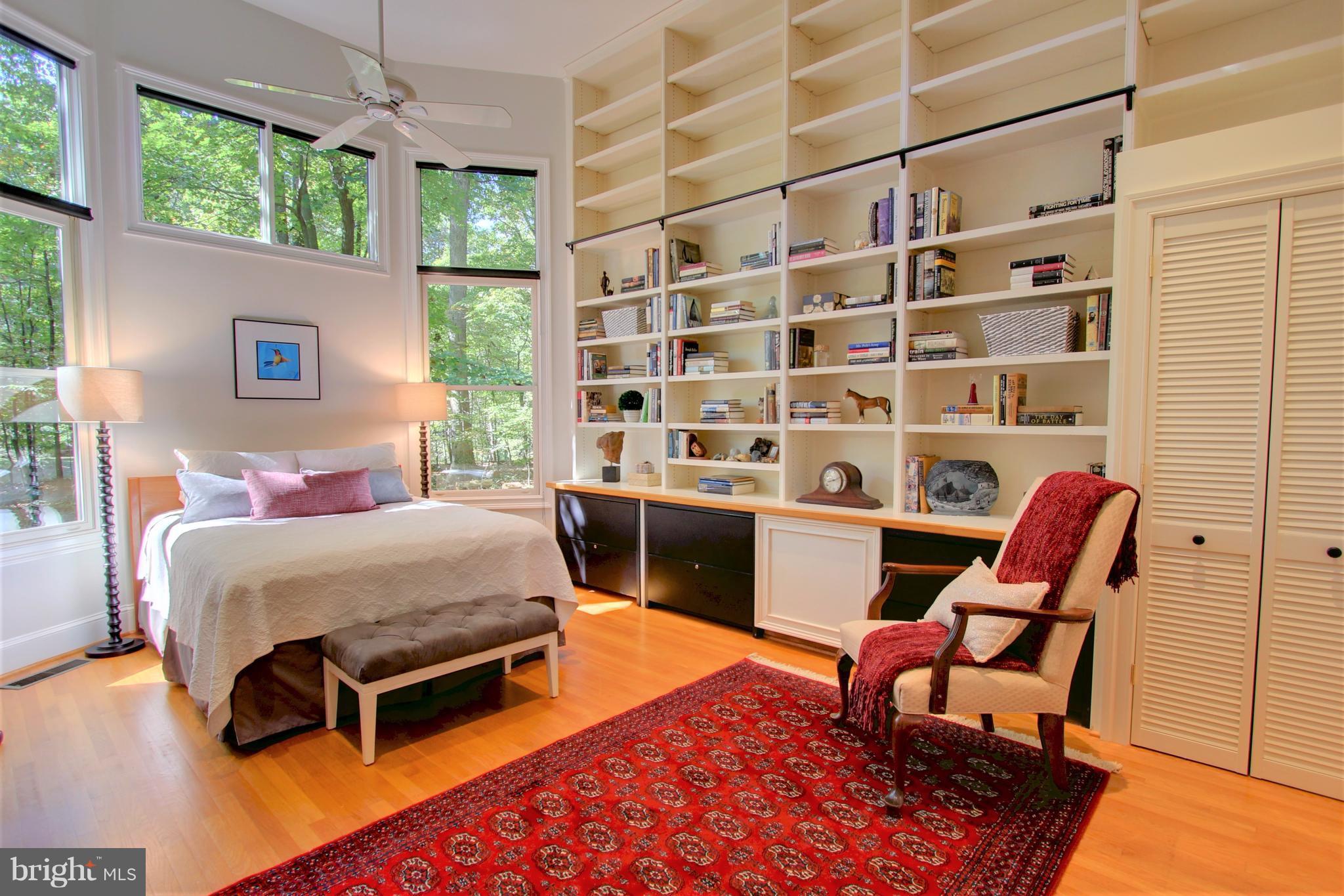 13705 Loria Court Clarksville, MD 21029 - Photo 21 of 30 a bedroom with a bed and a bookshelf