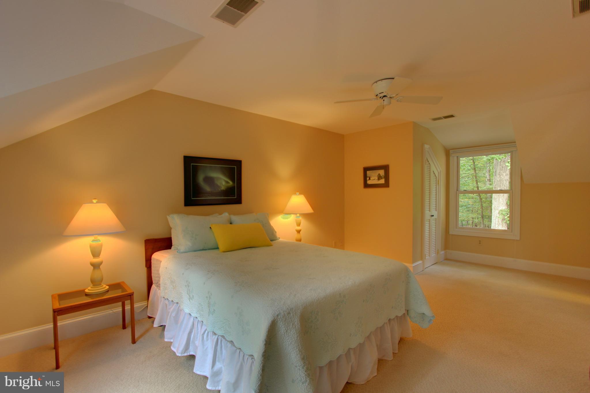 13705 Loria Court Clarksville, MD 21029 - Photo 22 of 30 a bedroom with a bed and a lamp with window