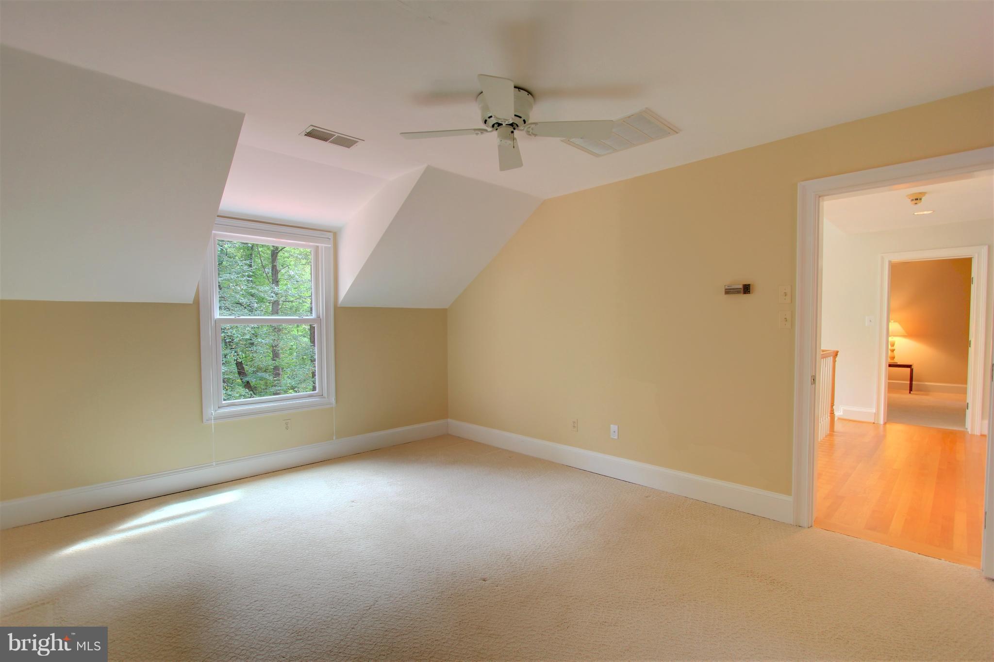 13705 Loria Court Clarksville, MD 21029 - Photo 23 of 30 a view of a big room with windows and chandelier fan