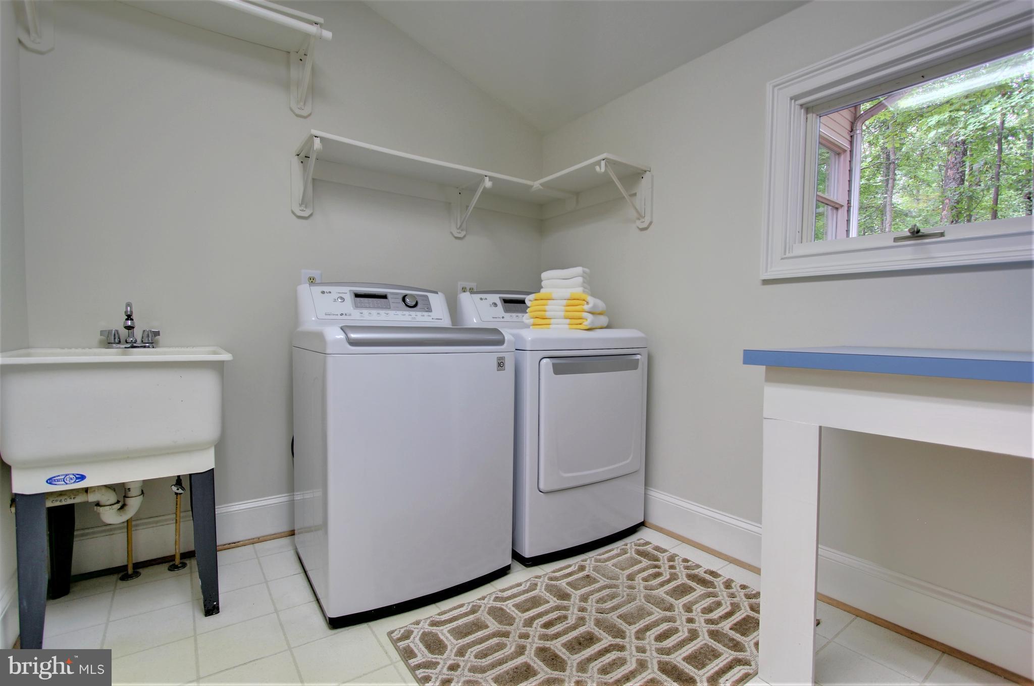 13705 Loria Court Clarksville, MD 21029 - Photo 26 of 30 a utility room with closet dryer and washer
