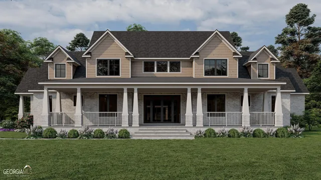 a view of a white house with a large windows and a yard