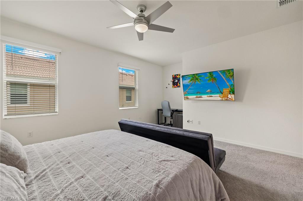 2934 Citrus Street Naples, FL 34120 - Photo 13 of 29 a bedroom with a bed and a flat screen tv