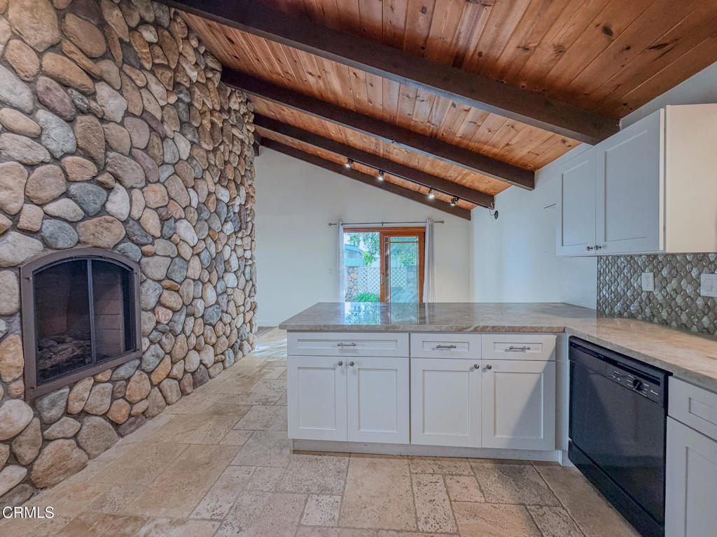 5142 Sandpiper Way Oxnard, CA 93035 - Photo 16 of 51 a kitchen with a sink and cabinets