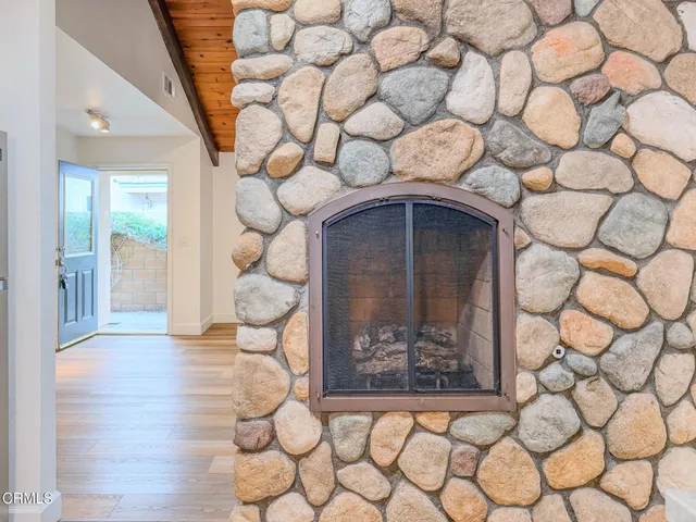 a view of a kitchen with granite countertop cabinets