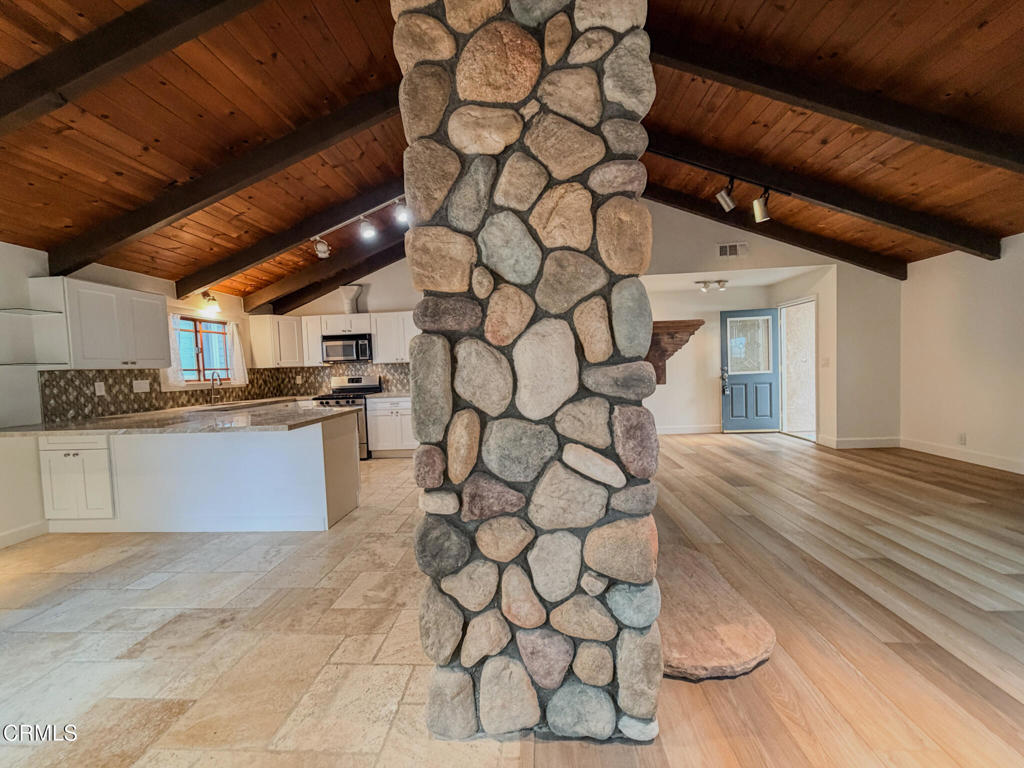 5142 Sandpiper Way Oxnard, CA 93035 - Photo 19 of 51 a kitchen with a sink a stove and cabinets
