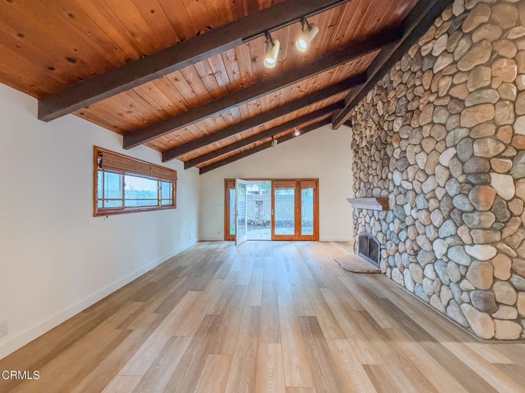 5142 Sandpiper Way Oxnard, CA 93035 - Photo 22 of 51 a big room with wooden floor and windows