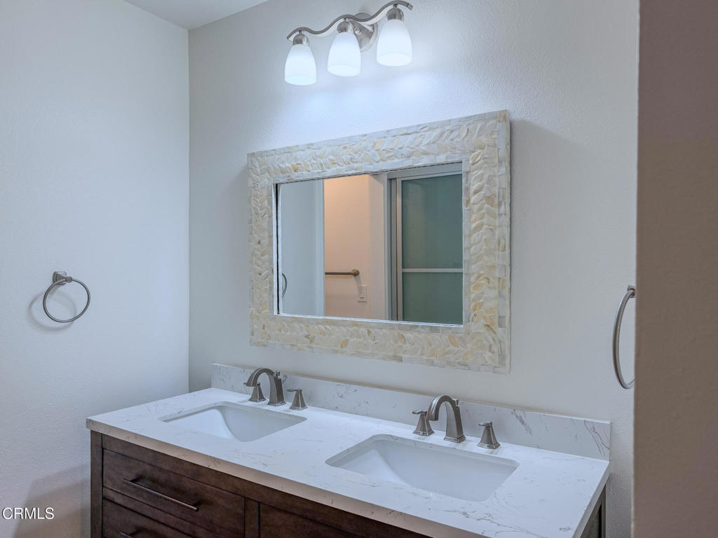 5142 Sandpiper Way Oxnard, CA 93035 - Photo 29 of 51 a bathroom with a sink and a mirror
