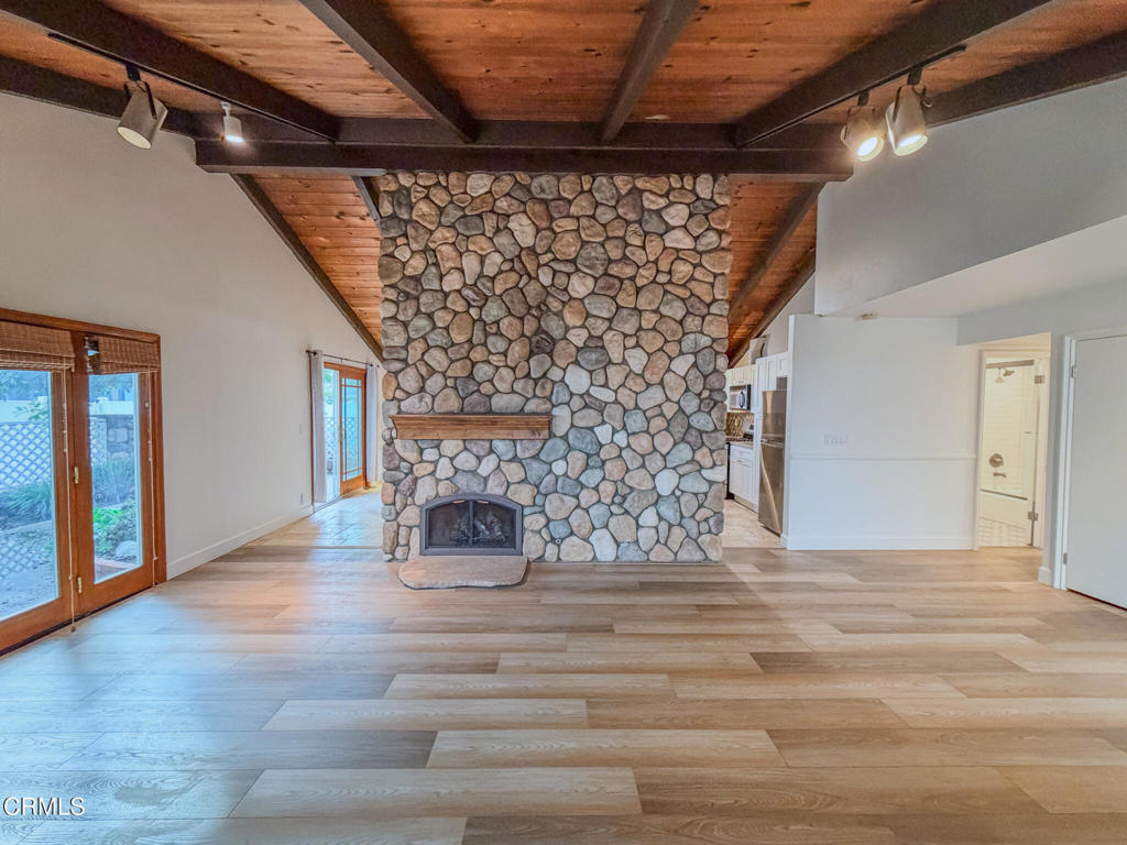 5142 Sandpiper Way Oxnard, CA 93035 - Photo 3 of 51 a view of an empty room with wooden floor and a window