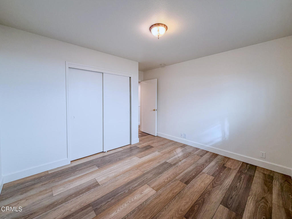 5142 Sandpiper Way Oxnard, CA 93035 - Photo 35 of 51 a view of an empty room with wooden floor