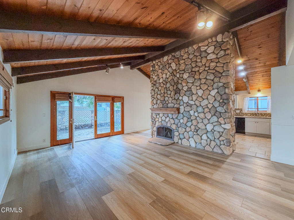 5142 Sandpiper Way Oxnard, CA 93035 - Photo 4 of 51 a view of an empty room with wooden floor and a window