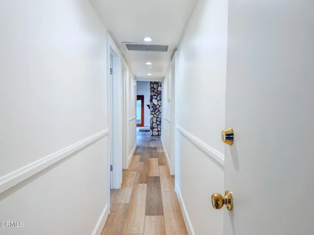 a view of a back yard with flower plants