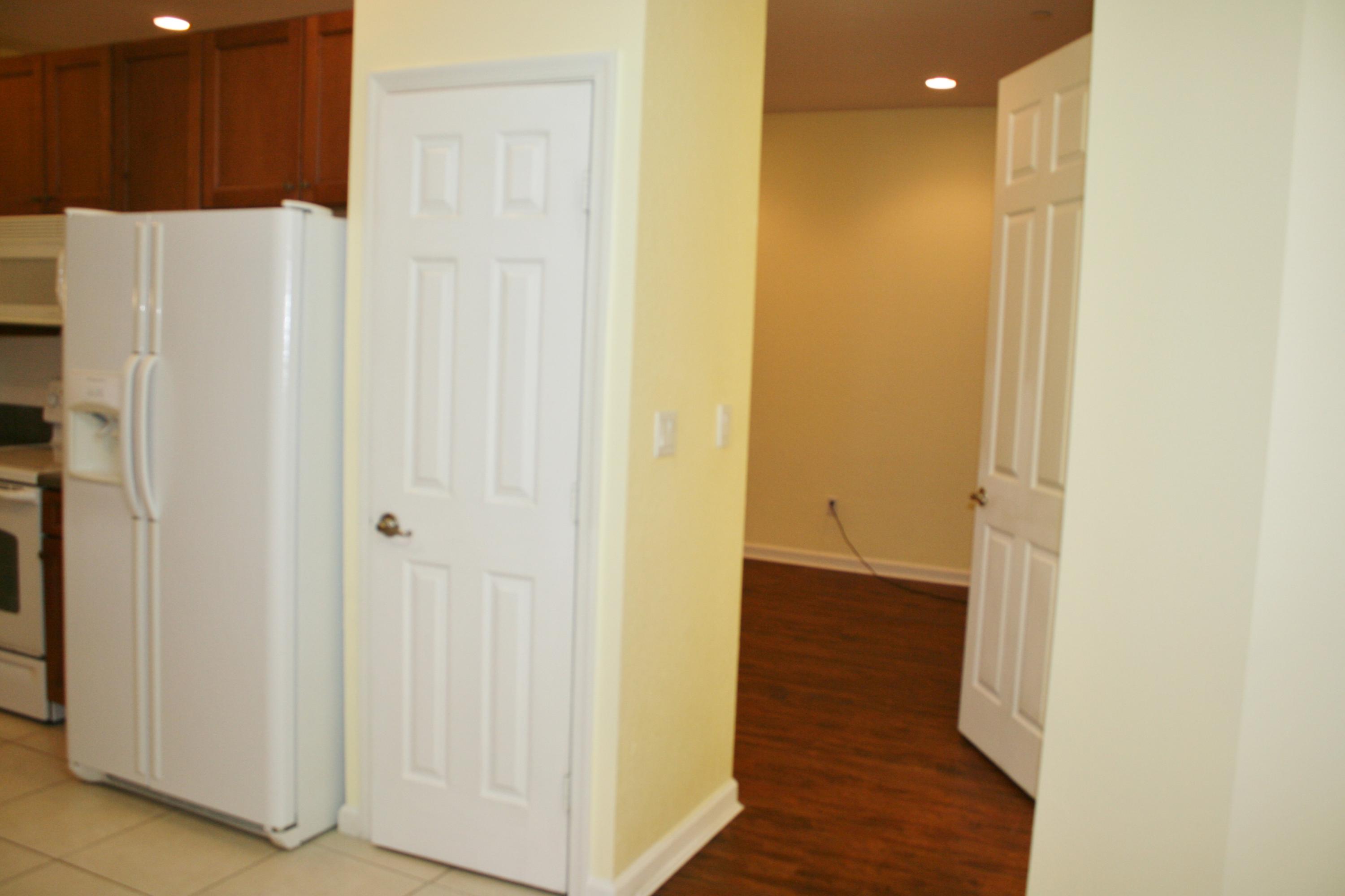 334 Southwest Walking Path, Unit 334 Stuart, FL 34997 - Photo 11 of 34 a view of a hallway with wooden floor