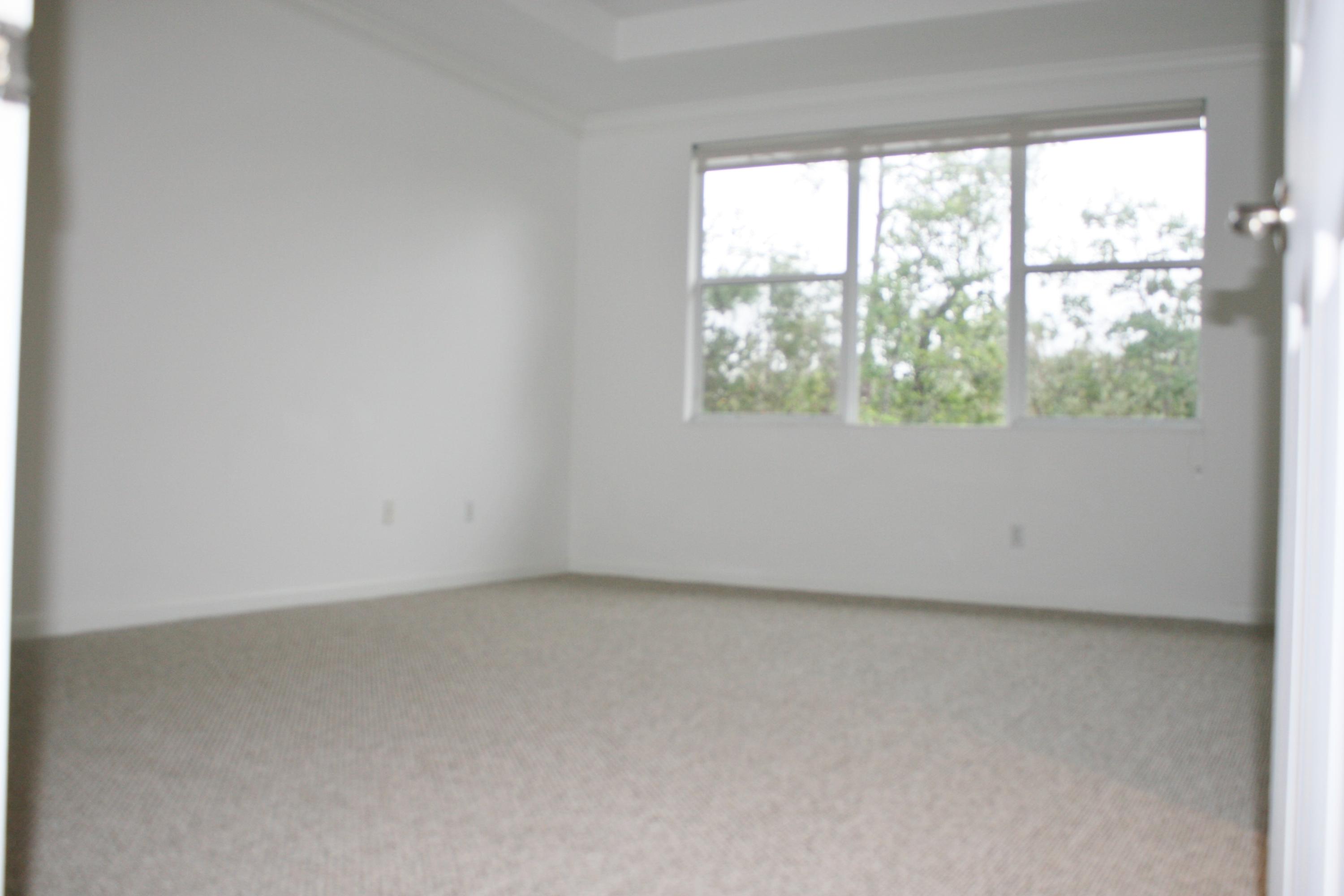 334 Southwest Walking Path, Unit 334 Stuart, FL 34997 - Photo 19 of 34 an empty room with a window