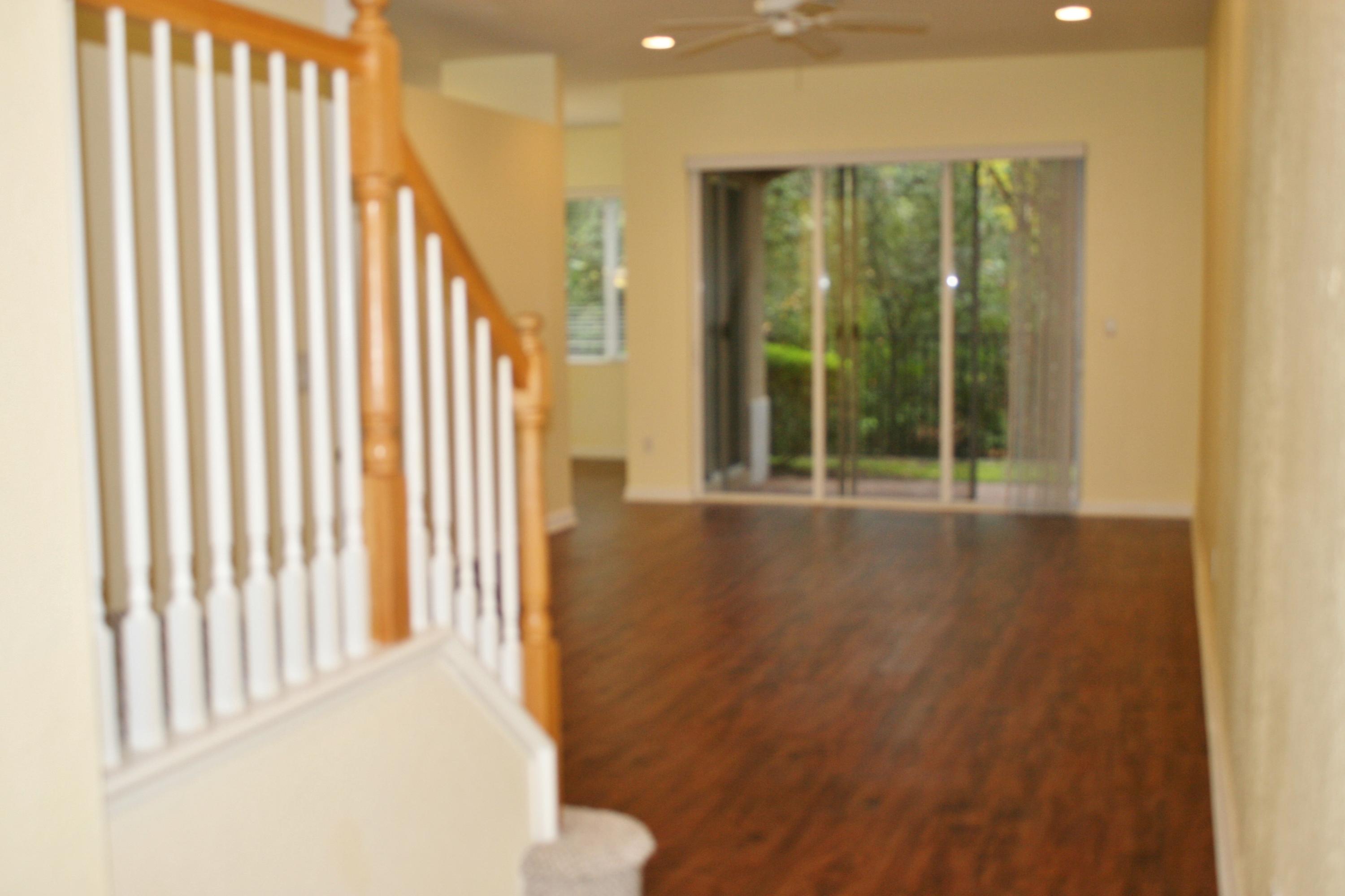 334 Southwest Walking Path, Unit 334 Stuart, FL 34997 - Photo 4 of 34 a view of a porch with a floor to ceiling window