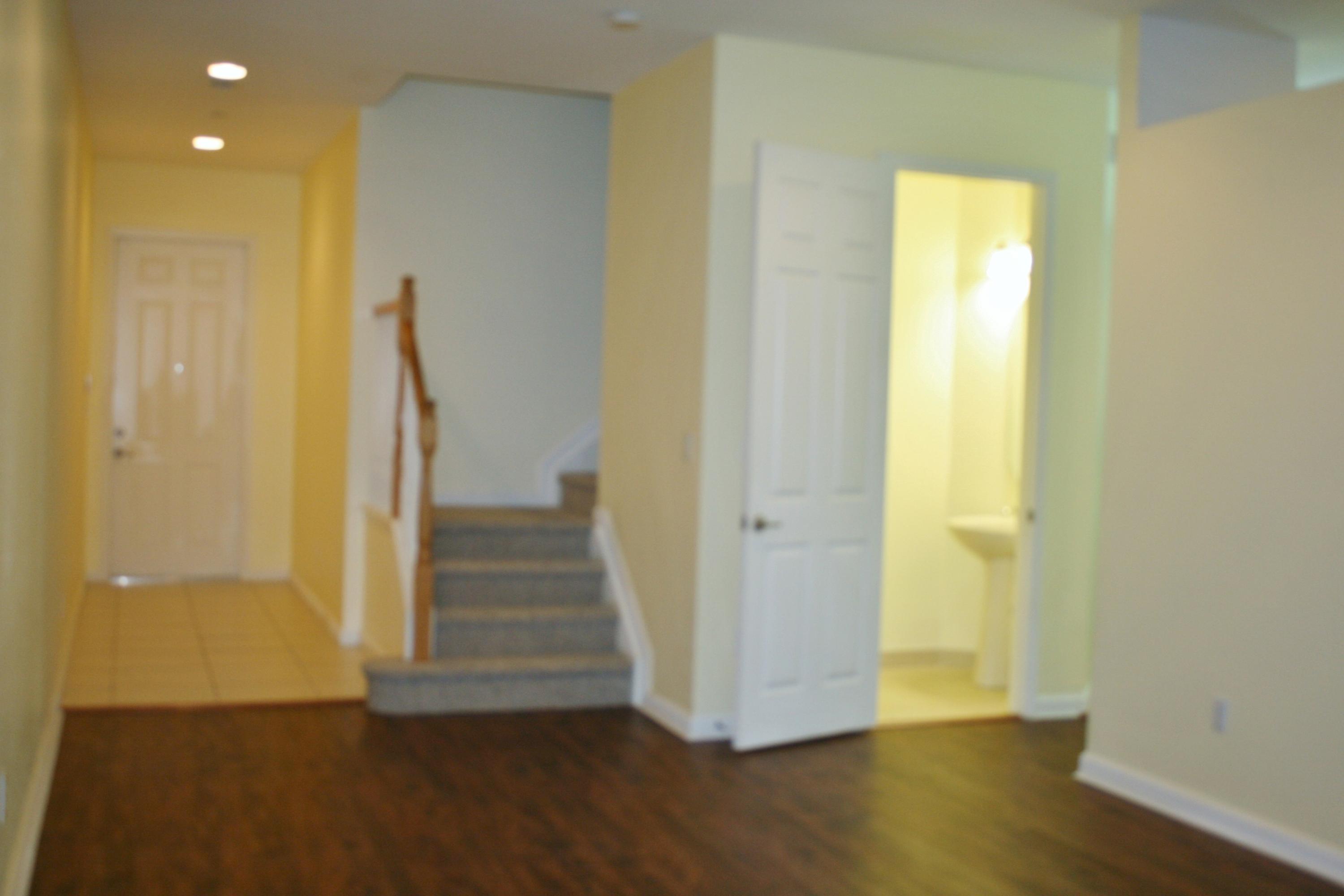 334 Southwest Walking Path, Unit 334 Stuart, FL 34997 - Photo 7 of 34 a view of a hallway with wooden floor