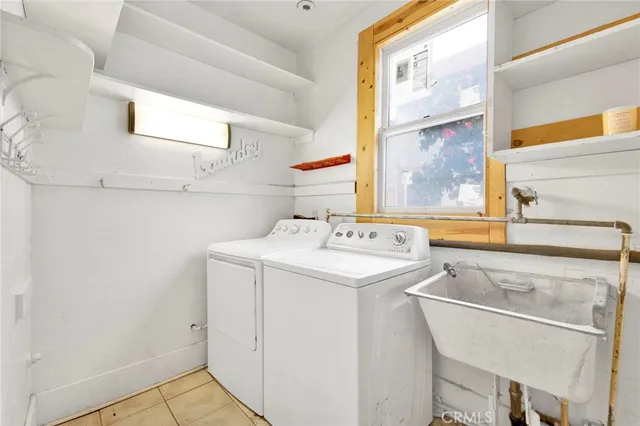 a bathroom with a sink mirror vanity and toilet