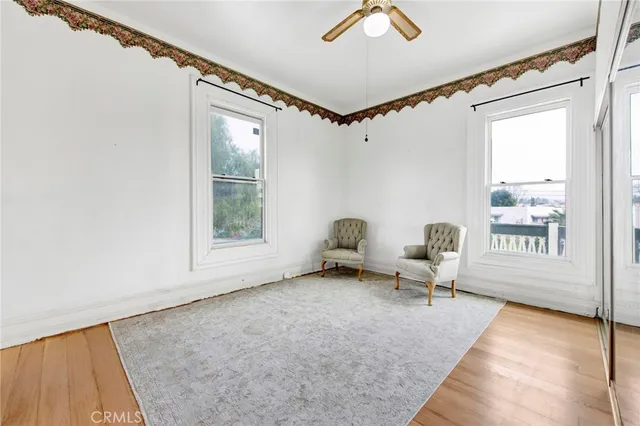 a bedroom with furniture and a window