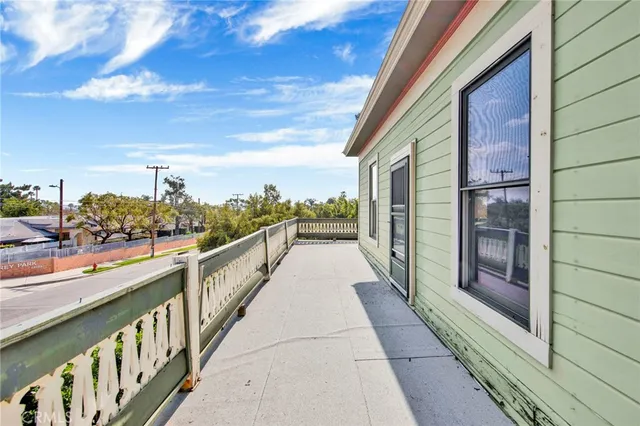 a front view of a house with yard and green space