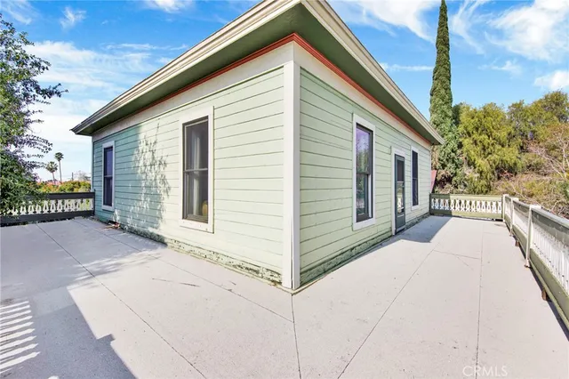 a view of a garden with a building in the background