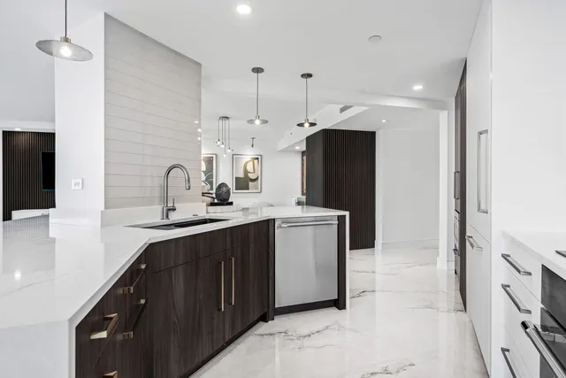 a kitchen with a sink and refrigerator