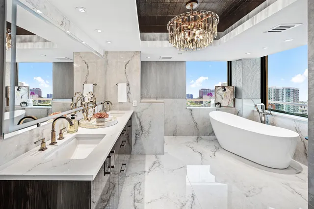 a living room with furniture and chandelier