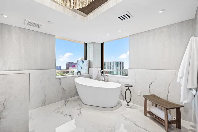 a living room with a couch and a refrigerator