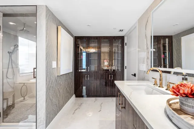 a bathroom with a sink and a mirror