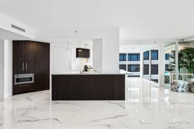 a view of kitchen with sink microwave and refrigerator