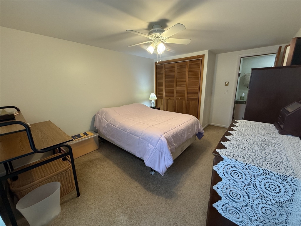 5 Fairview Park Road, Unit 10 Sturbridge, MA 01566 - Photo 15 of 28 a bedroom with a bed and a window