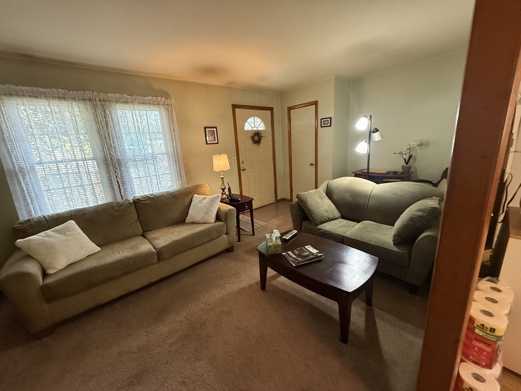 5 Fairview Park Road, Unit 10 Sturbridge, MA 01566 - Photo 8 of 28 a living room with furniture and a large window