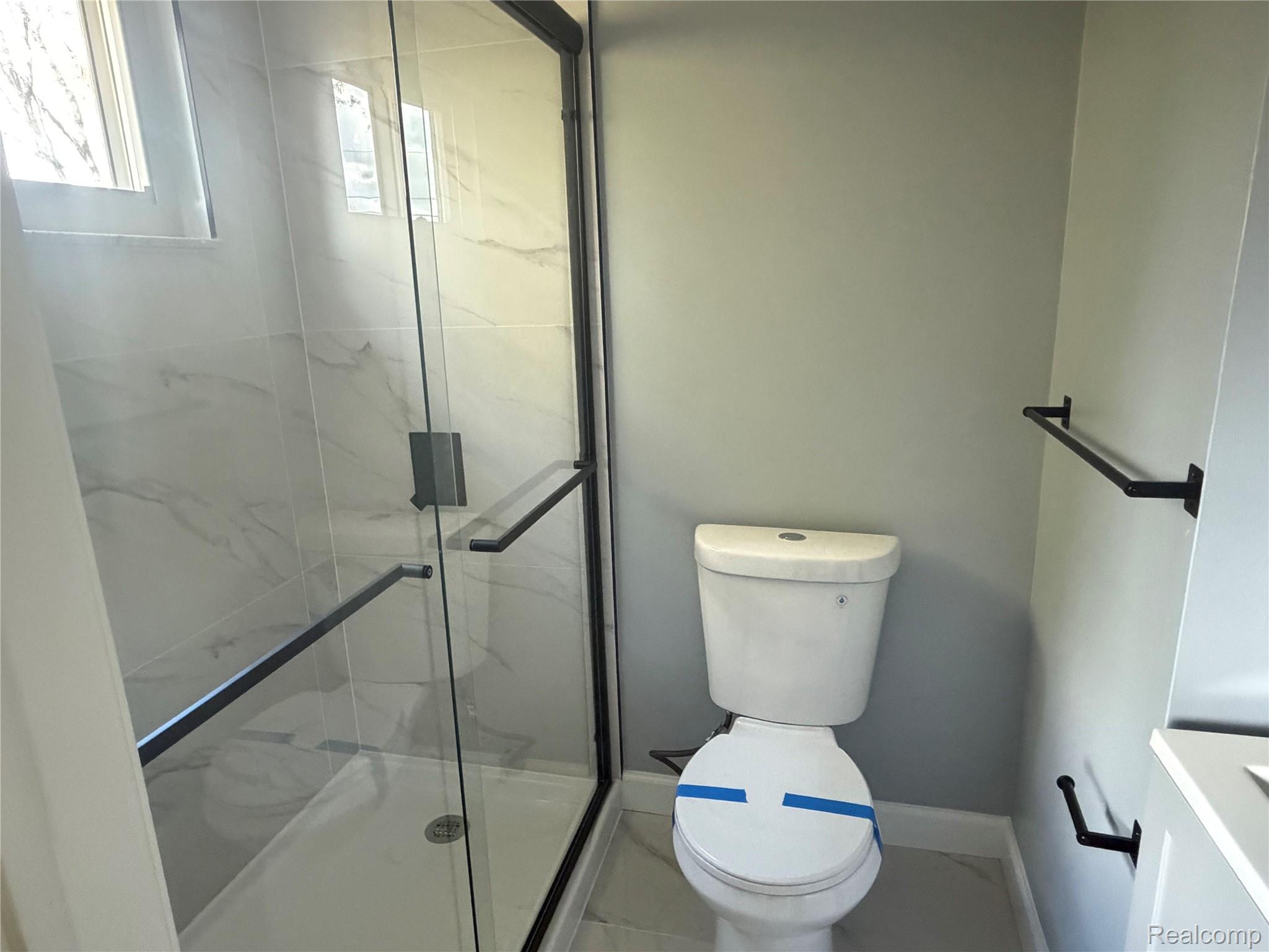 20698 Coachwood Road Riverview, MI 48193 - Photo 26 of 37 Bathroom featuring a marble finish shower and toilet