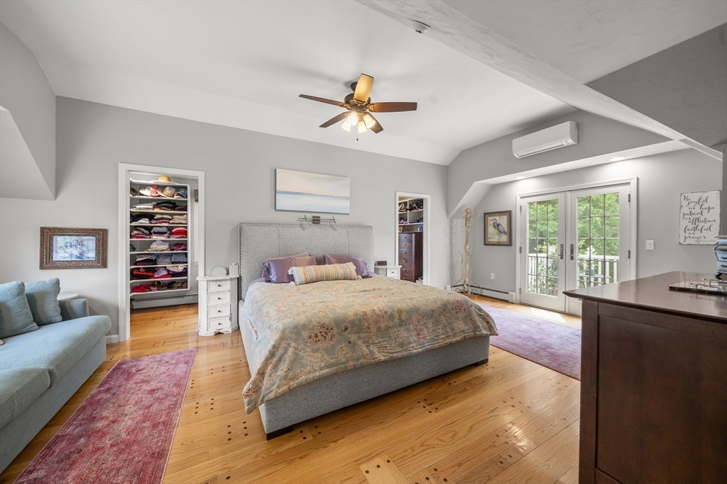 30 Franklin Rodgers Road Hingham, MA 02043 - Photo 25 of 37 a bedroom with a large bed a couch and a window