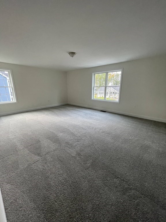 12 Hayfield Road, Unit 1 Dracut, MA 01826 - Photo 17 of 32 an empty room with windows
