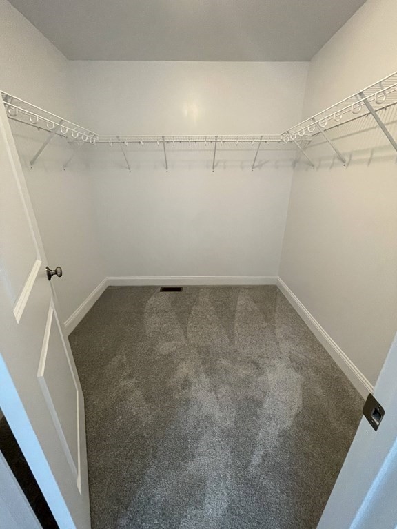 12 Hayfield Road, Unit 1 Dracut, MA 01826 - Photo 22 of 32 a view of a room with racks on the wall