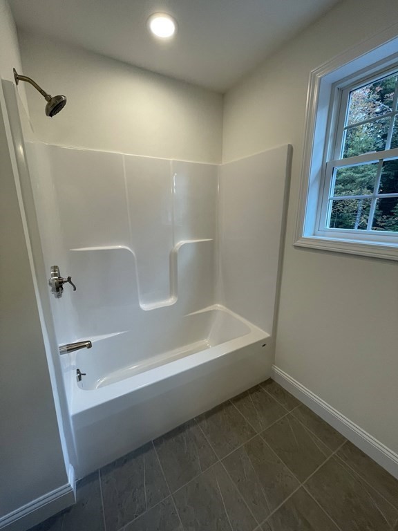 12 Hayfield Road, Unit 1 Dracut, MA 01826 - Photo 28 of 32 a bathroom with a bathtub