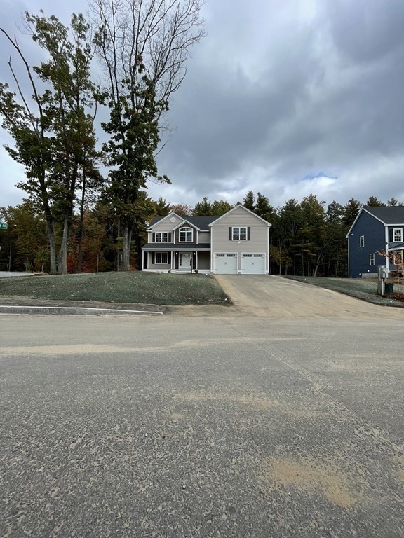 12 Hayfield Road, Unit 1 Dracut, MA 01826 - Photo 3 of 32 a view of a house with a yard