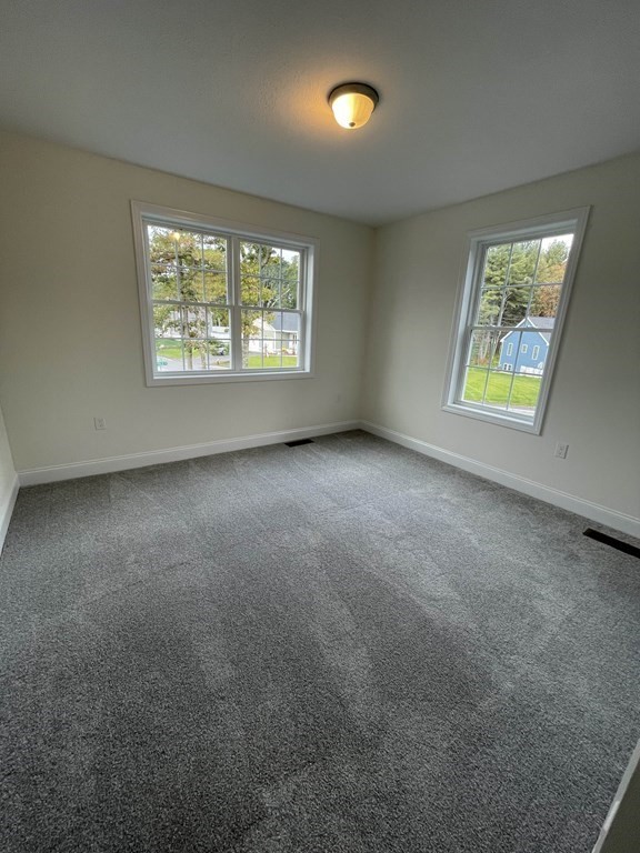 12 Hayfield Road, Unit 1 Dracut, MA 01826 - Photo 31 of 32 an empty room with windows
