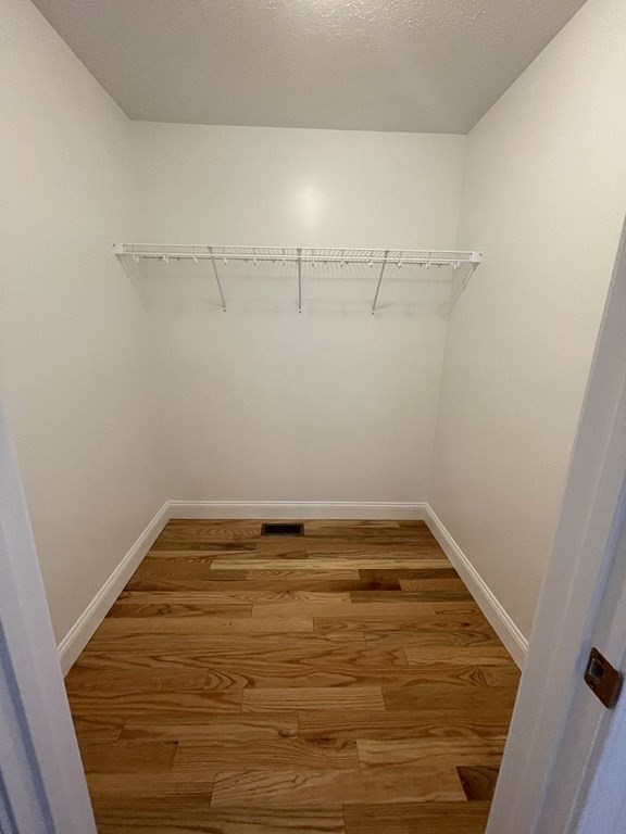 12 Hayfield Road, Unit 1 Dracut, MA 01826 - Photo 32 of 32 a view of a room with racks on the wall