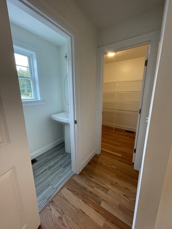 12 Hayfield Road, Unit 1 Dracut, MA 01826 - Photo 10 of 32 a view of wooden floor in a room