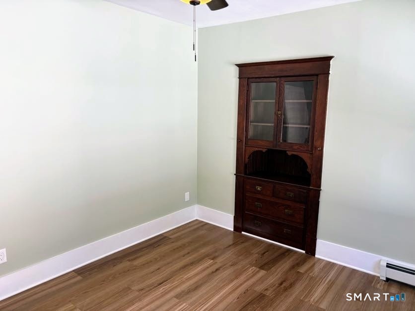 61 Main Street, Unit B Deep River, CT 06417 - Photo 3 of 13 a view of a hallway with wooden floor and a dresser
