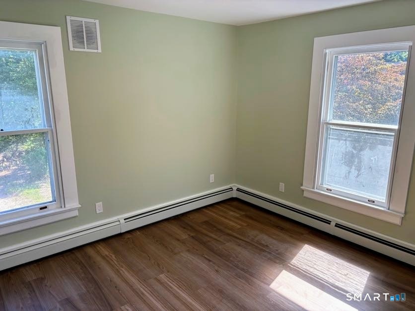61 Main Street, Unit B Deep River, CT 06417 - Photo 8 of 13 a view of a small space with wooden floor and a window
