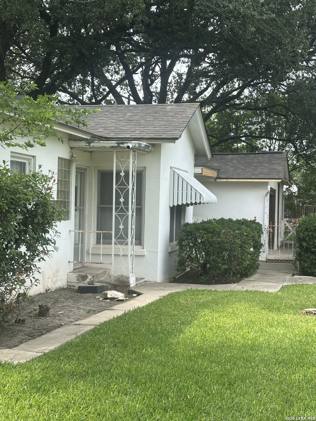 844 Laurel Street Uvalde, TX 78801 - Photo 2 of 17 front view of a house with a yard