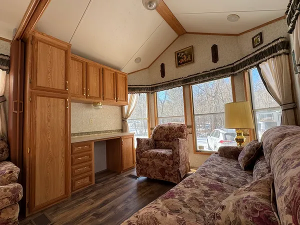 a bed room with a bed next to a window