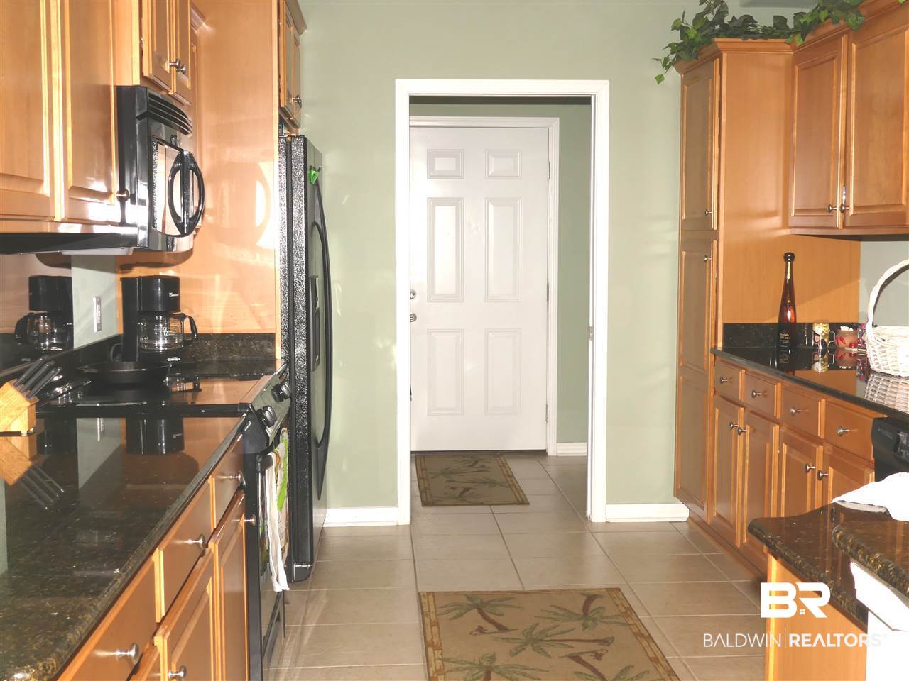 7117 Raintree Lane Gulf Shores, AL 36542 - Photo 9 of 23 Kitchen to Laundry