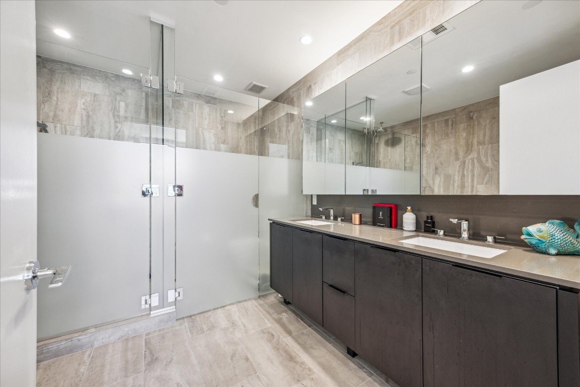44 East Avenue, Unit 4203 Austin, TX 78701 - Photo 18 of 26 a kitchen with a sink and cabinets