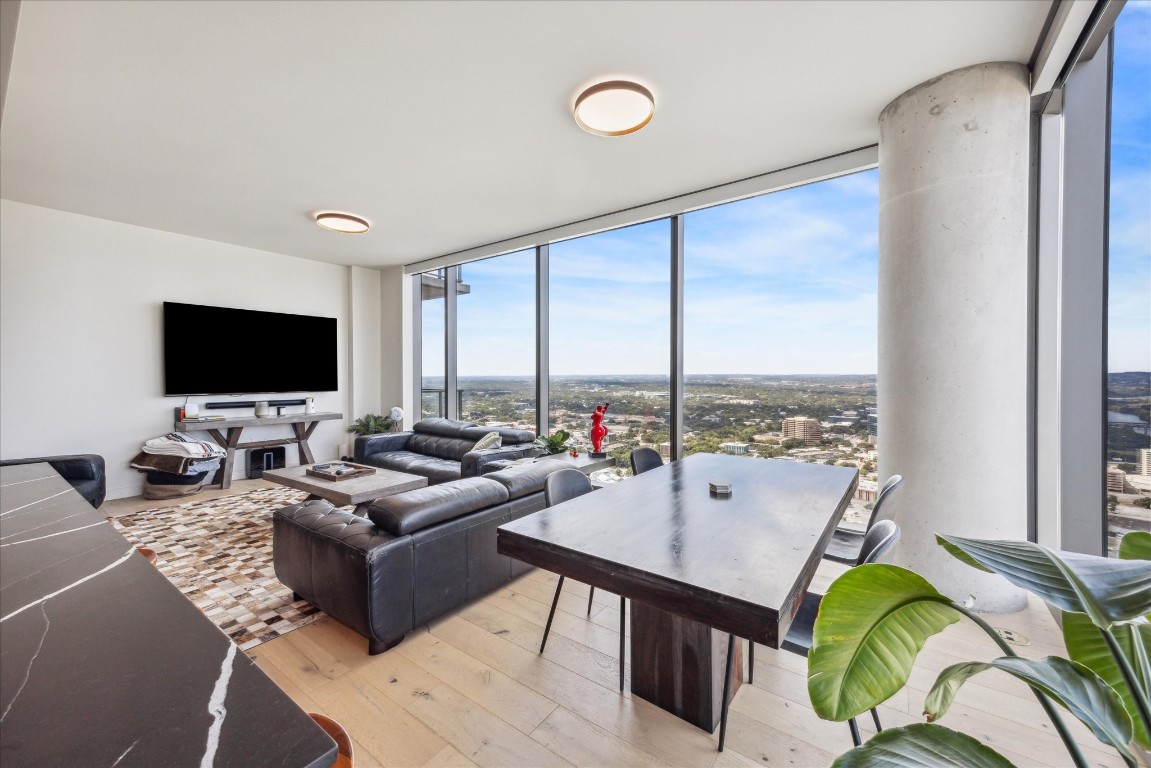 44 East Avenue, Unit 4203 Austin, TX 78701 - Photo 3 of 26 a living room with furniture and a flat screen tv